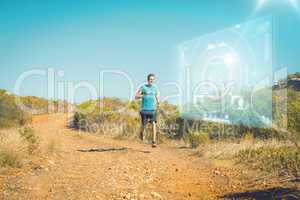 Composite image of athletic man jogging on country trail