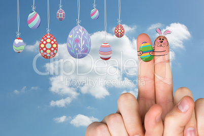 Composite image of fingers as easter bunny