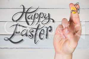 Composite image of fingers as easter bunny