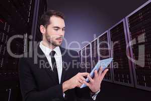 Composite image of cheerful businessman touching digital tablet