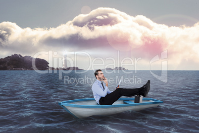 Composite image of businessman in boat with tablet pc