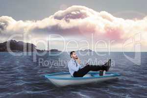 Composite image of businessman in boat with tablet pc