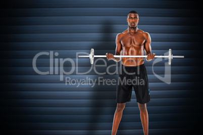 Composite image of portrait of a serious fit young man lifting b