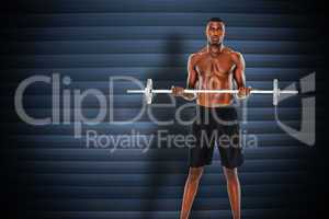 Composite image of portrait of a serious fit young man lifting b