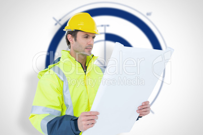 Composite image of architect analyzing blueprint over white back