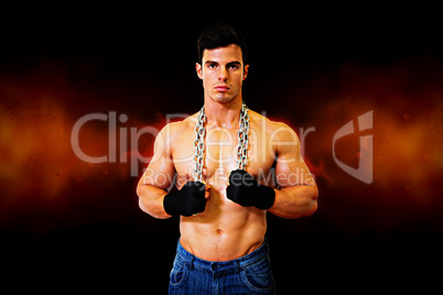 Composite image of portrait of a serious shirtless young muscula