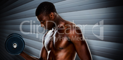 Composite image of serious fit shirtless young man lifting dumbb