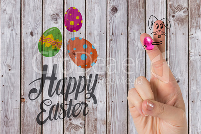 Composite image of fingers as easter bunny