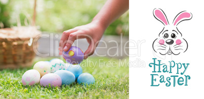 Composite image of little girl collecting easter eggs