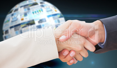 Composite image of close up on partners shaking hands