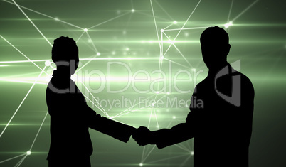 Composite image of smiling business people shaking hands while l