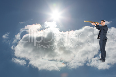 Composite image of businessman looking through telescope