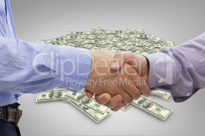 Composite image of two men shaking hands