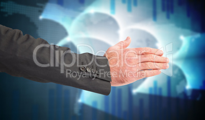 Composite image of businessman reaching hand out