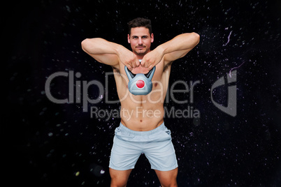 Composite image of bodybuilder holding kettlebell