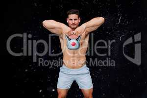 Composite image of bodybuilder holding kettlebell