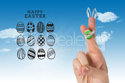 Composite image of fingers as easter bunny