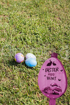 Composite image of easter egg hunt sign