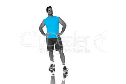 Composite image of full length portrait of a fit young man smili
