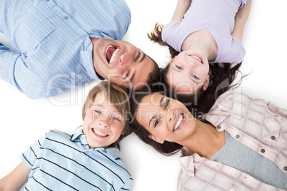 Happy family lying on white background