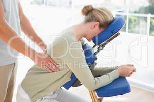 Woman having back massage