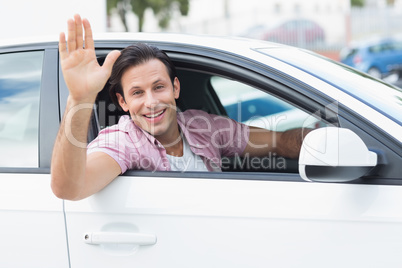 Man smiling and waving