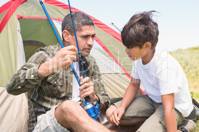 Father and son by their tent