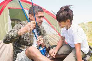 Father and son by their tent