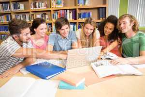 College students using laptop in library