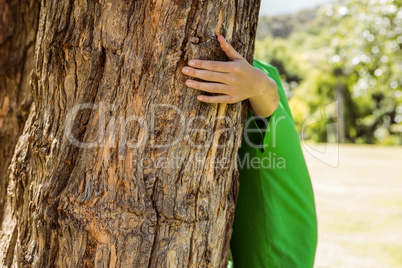 Environmental activist hugging a tree