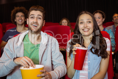 Young couple watching a film