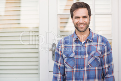 Happy man smiling in his garden