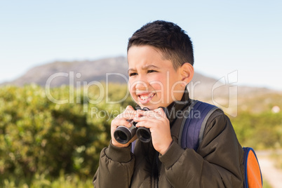 Little boy hiking in the mountains