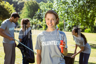 Team of volunteers picking up trash