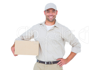 Confident delivery man with cardboard box on white background