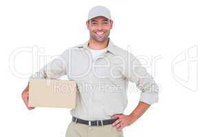 Confident delivery man with cardboard box on white background