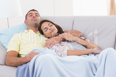 Couple sleeping in sofa