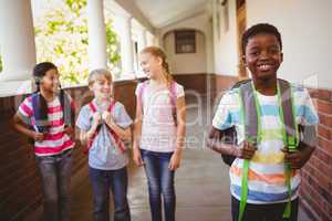 Little school kids in school corridor