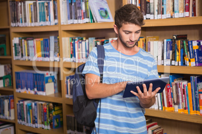 Student using tablet in library