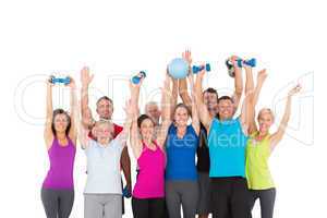 Cheerful people holding exercise equipment