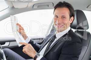 Businessman reading a map