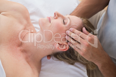 Woman receiving head massage