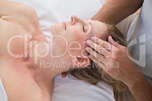 Woman receiving head massage
