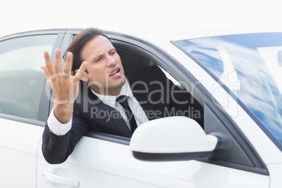 Businessman experiencing road rage