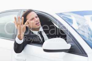 Businessman experiencing road rage