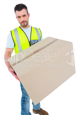 Delivery man holding cardboard box