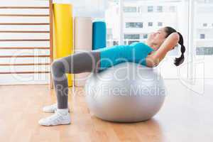 Woman exercising on fitness ball