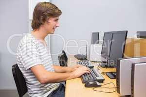 Student working on computer in classroom