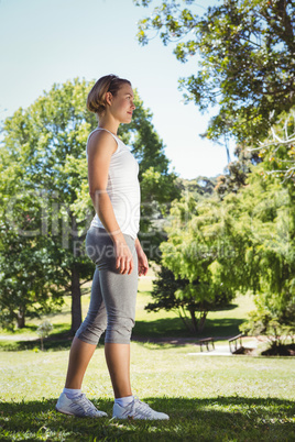 Fit woman walking in the park