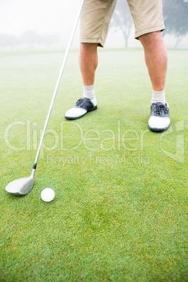 Golfer about to tee off